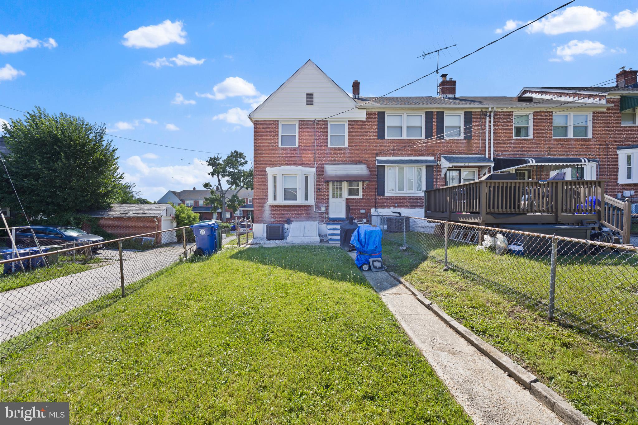 4511 Marble Hall Road Baltimore, MD 21239 - Photo 42 of 48 a front view of a house with garden