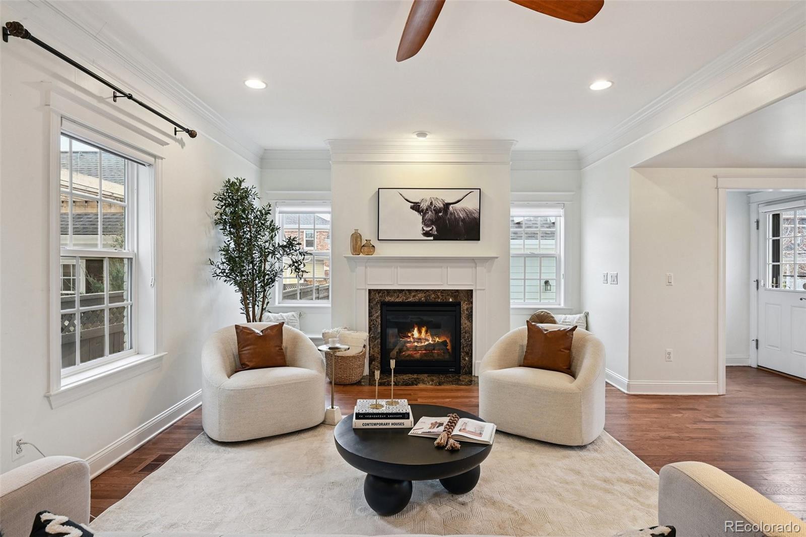 8741 East 33rd Avenue Denver, CO 80238 - Photo 15 of 43 a living room with furniture and a fireplace
