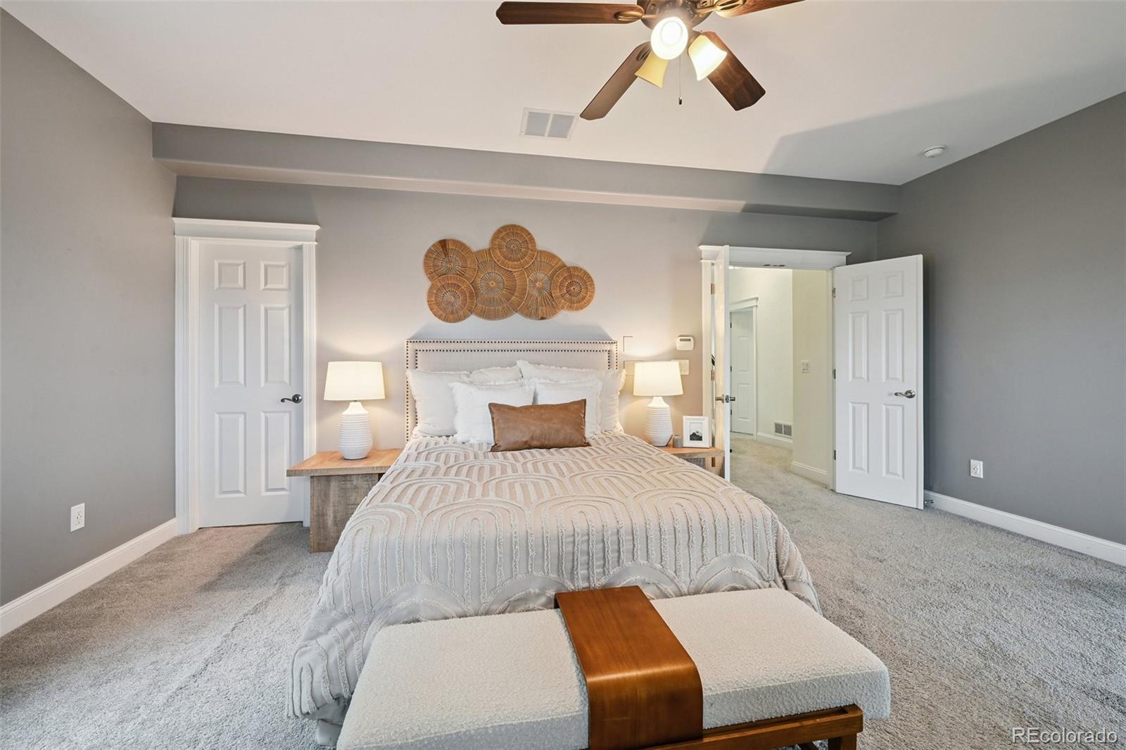 8741 East 33rd Avenue Denver, CO 80238 - Photo 20 of 43 a bedroom with a bed and chandelier