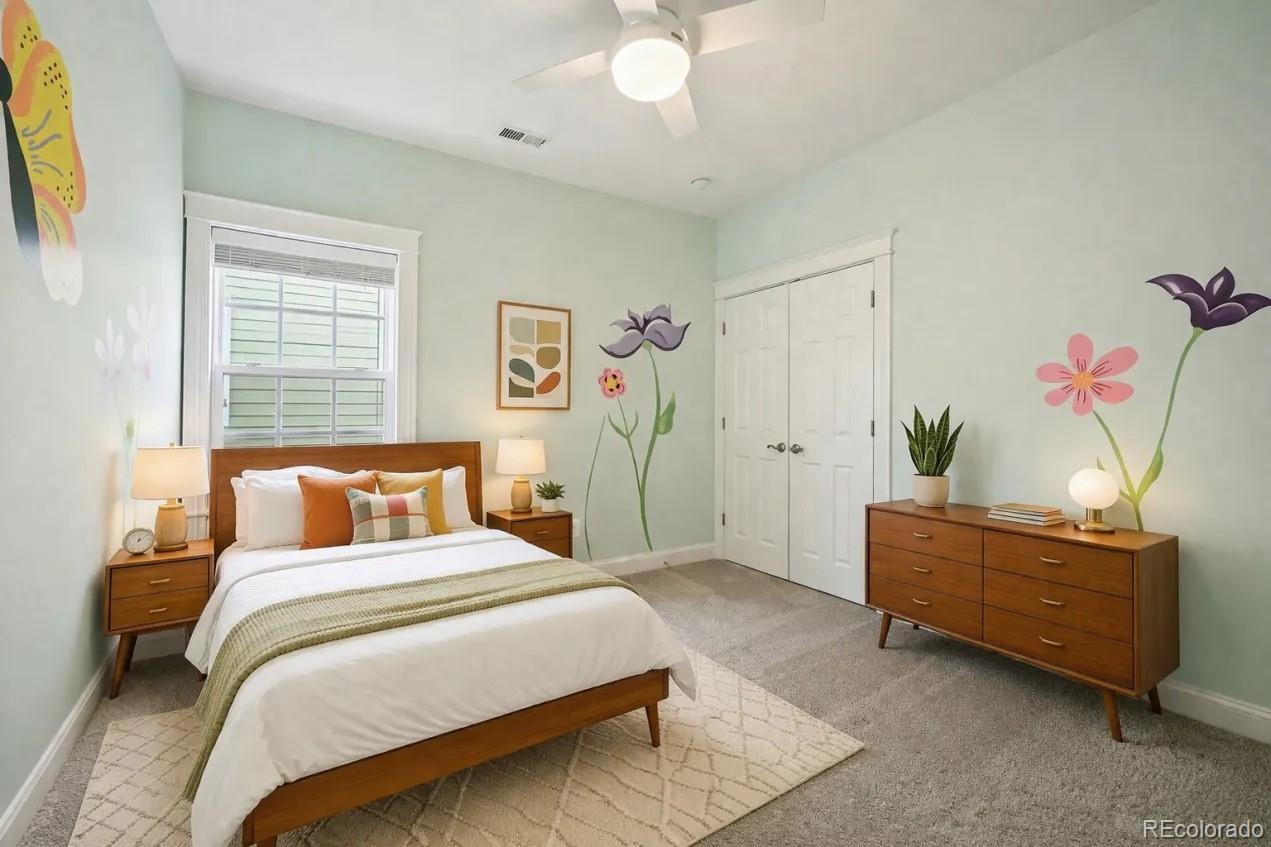 8741 East 33rd Avenue Denver, CO 80238 - Photo 25 of 43 a bedroom with a bed and a dresser