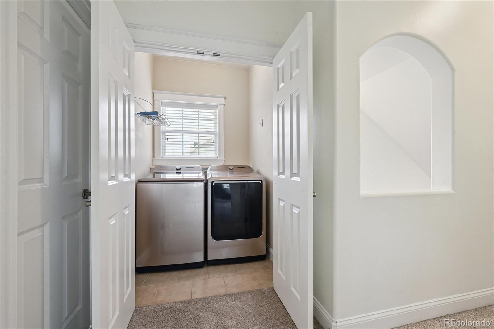 8741 East 33rd Avenue Denver, CO 80238 - Photo 27 of 43 a view of a kitchen with washer and dryer