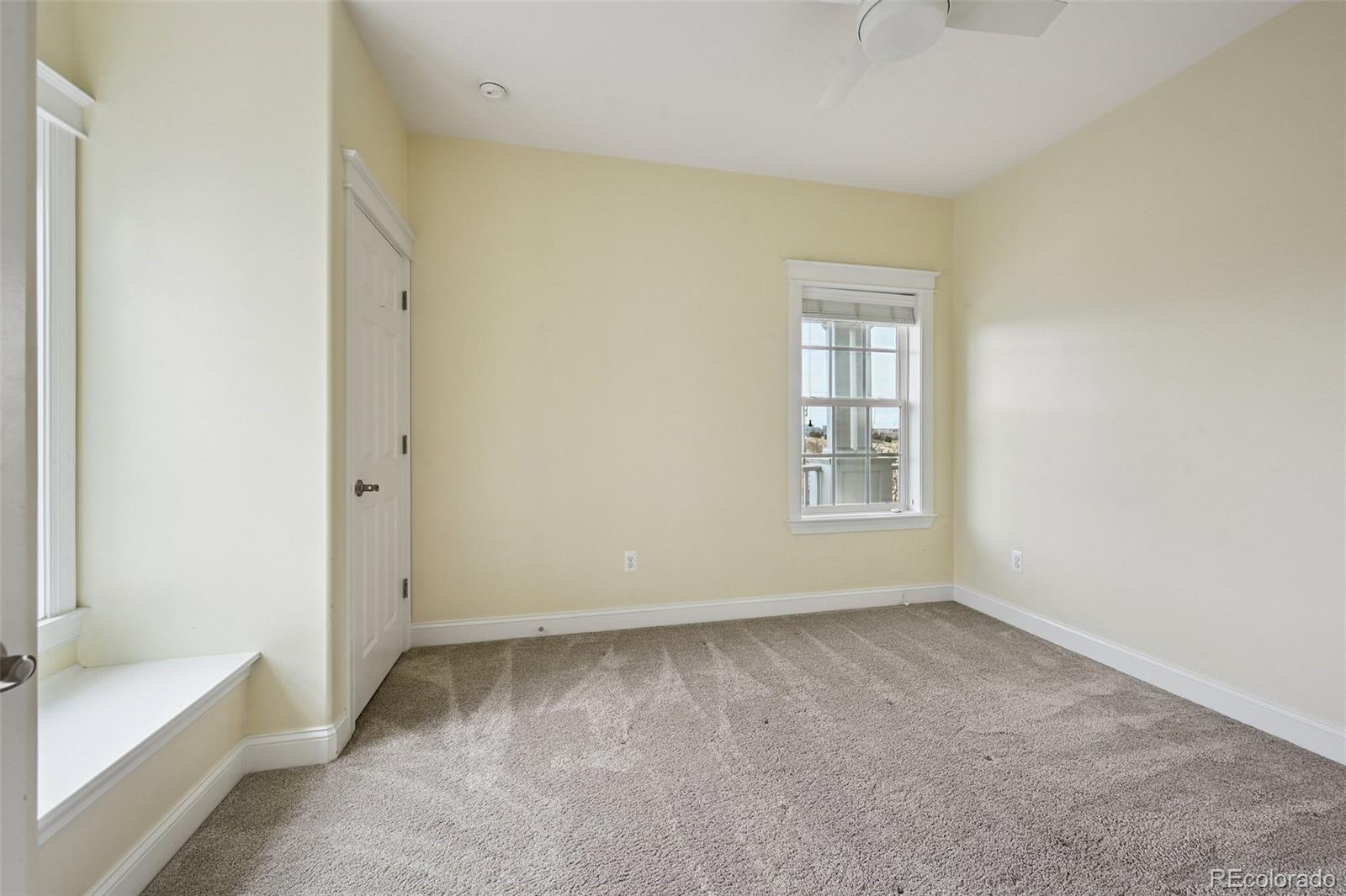 8741 East 33rd Avenue Denver, CO 80238 - Photo 29 of 43 a view of an empty room with a window