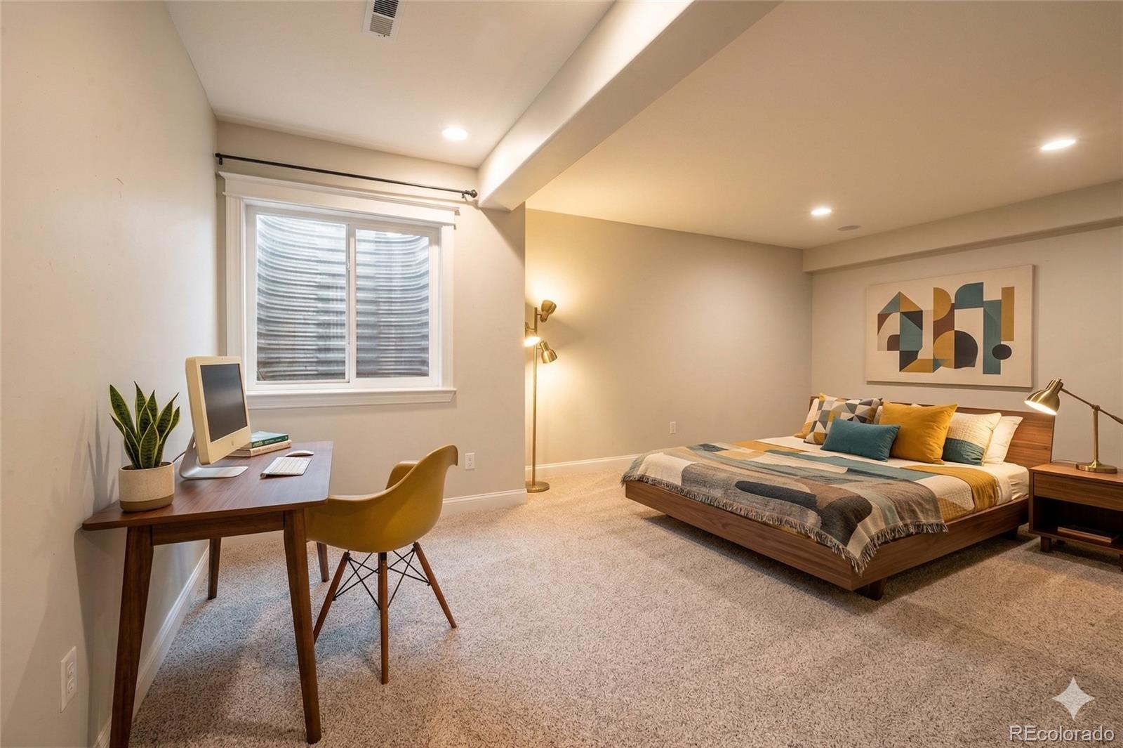 8741 East 33rd Avenue Denver, CO 80238 - Photo 35 of 43 a bedroom with a bed and a window