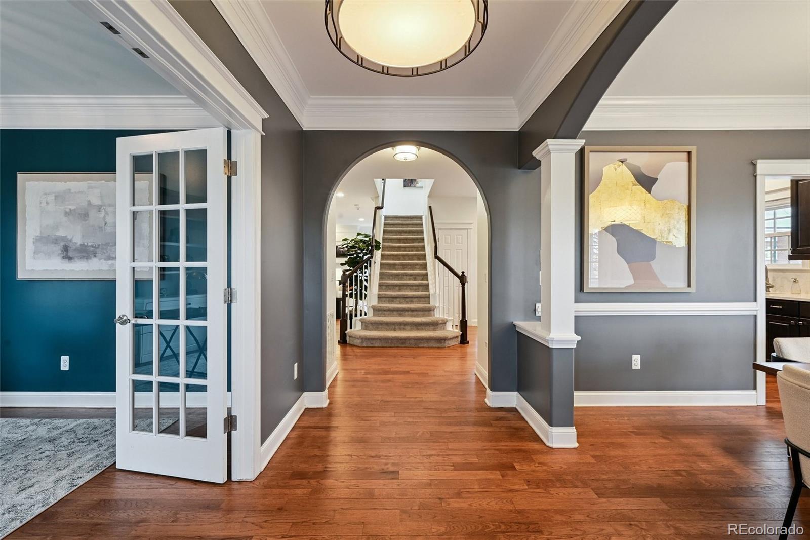 8741 East 33rd Avenue Denver, CO 80238 - Photo 9 of 43 a view of entryway and hall with wooden floor