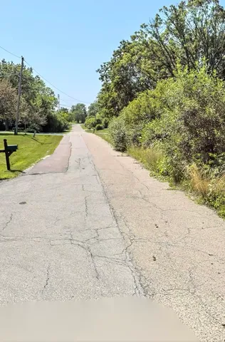 a view of a road with a yard