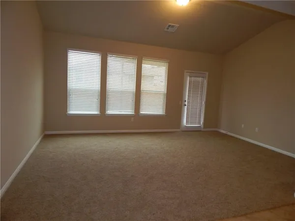 an empty room that has a window