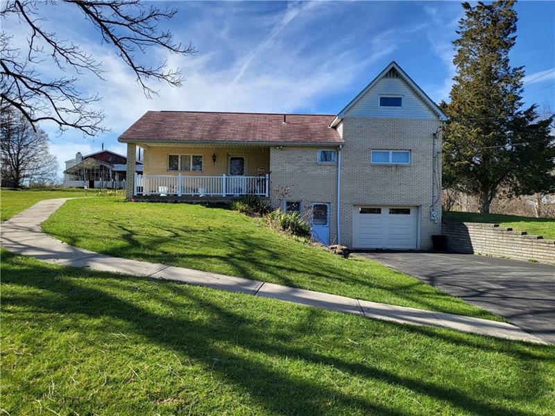 855 Hookstown Grade Road Coraopolis, PA 15108 - Photo 1 of 24 a front view of house with yard and green space