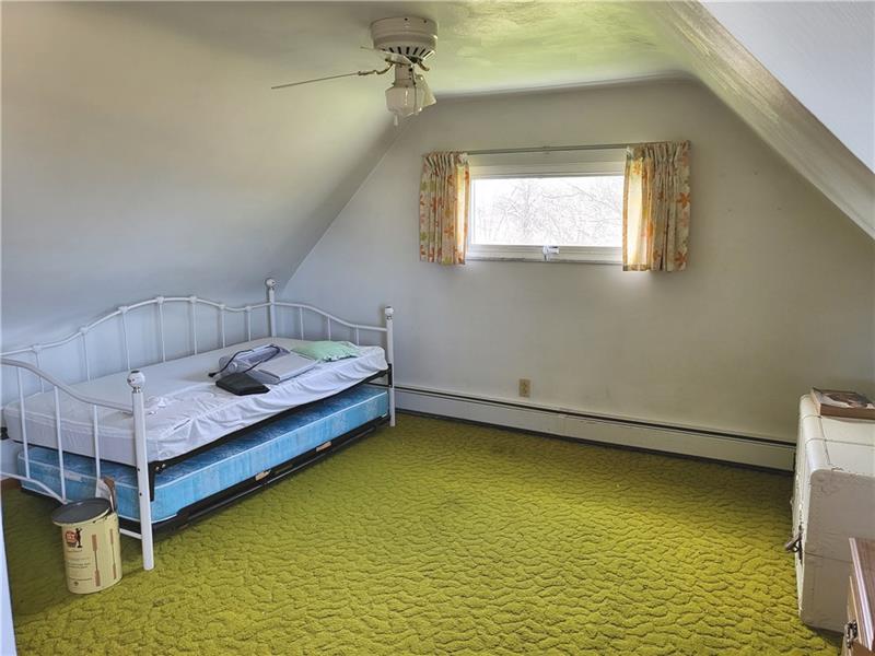855 Hookstown Grade Road Coraopolis, PA 15108 - Photo 11 of 24 a bedroom with a bed and window