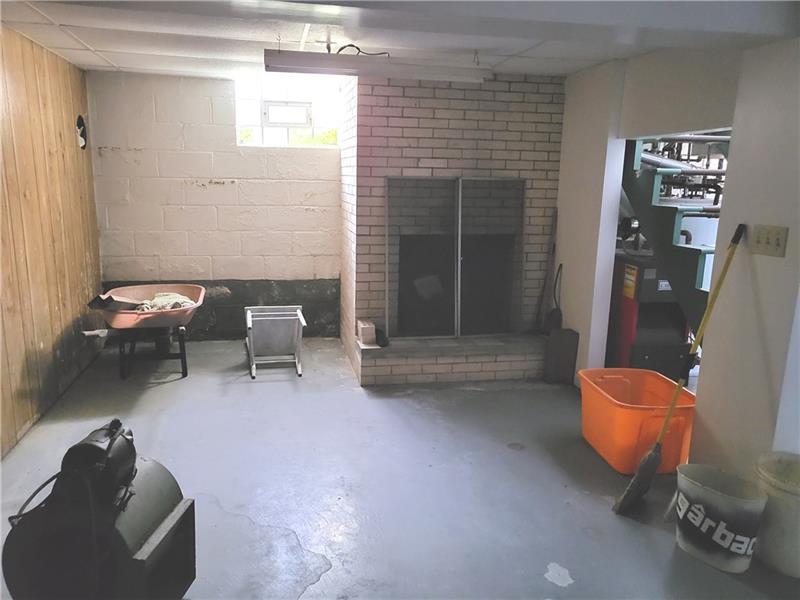 855 Hookstown Grade Road Coraopolis, PA 15108 - Photo 13 of 24 a living room with furniture and a chair