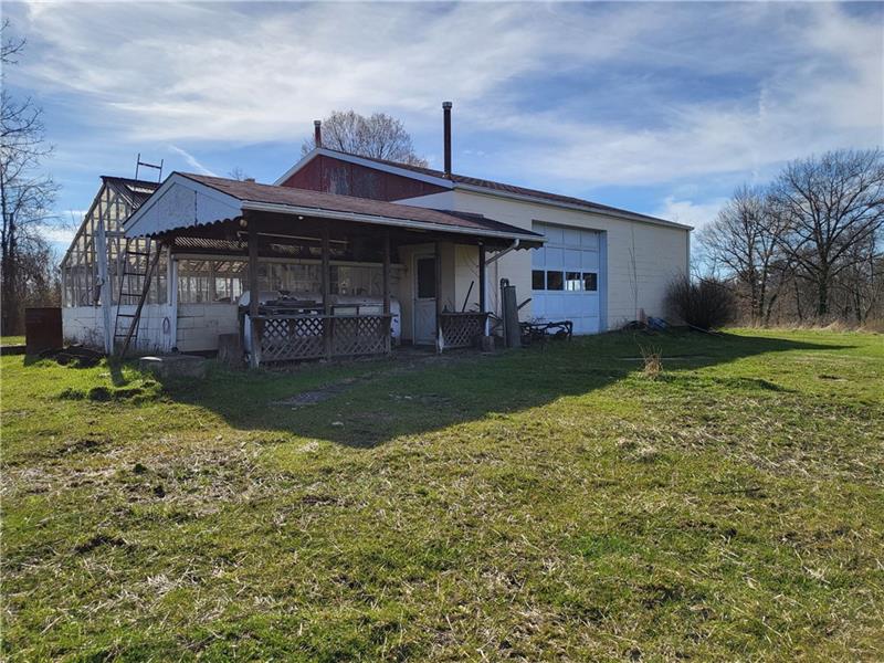 855 Hookstown Grade Road Coraopolis, PA 15108 - Photo 19 of 24 a view of a house with a big yard and large tree