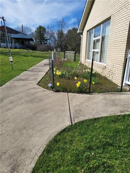 855 Hookstown Grade Road Coraopolis, PA 15108 - Photo 2 of 24 a front view of a house with garden
