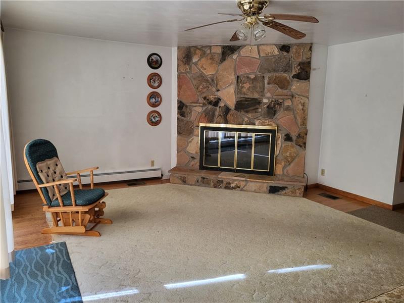 855 Hookstown Grade Road Coraopolis, PA 15108 - Photo 5 of 24 a view of a livingroom with furniture and a ceiling fan