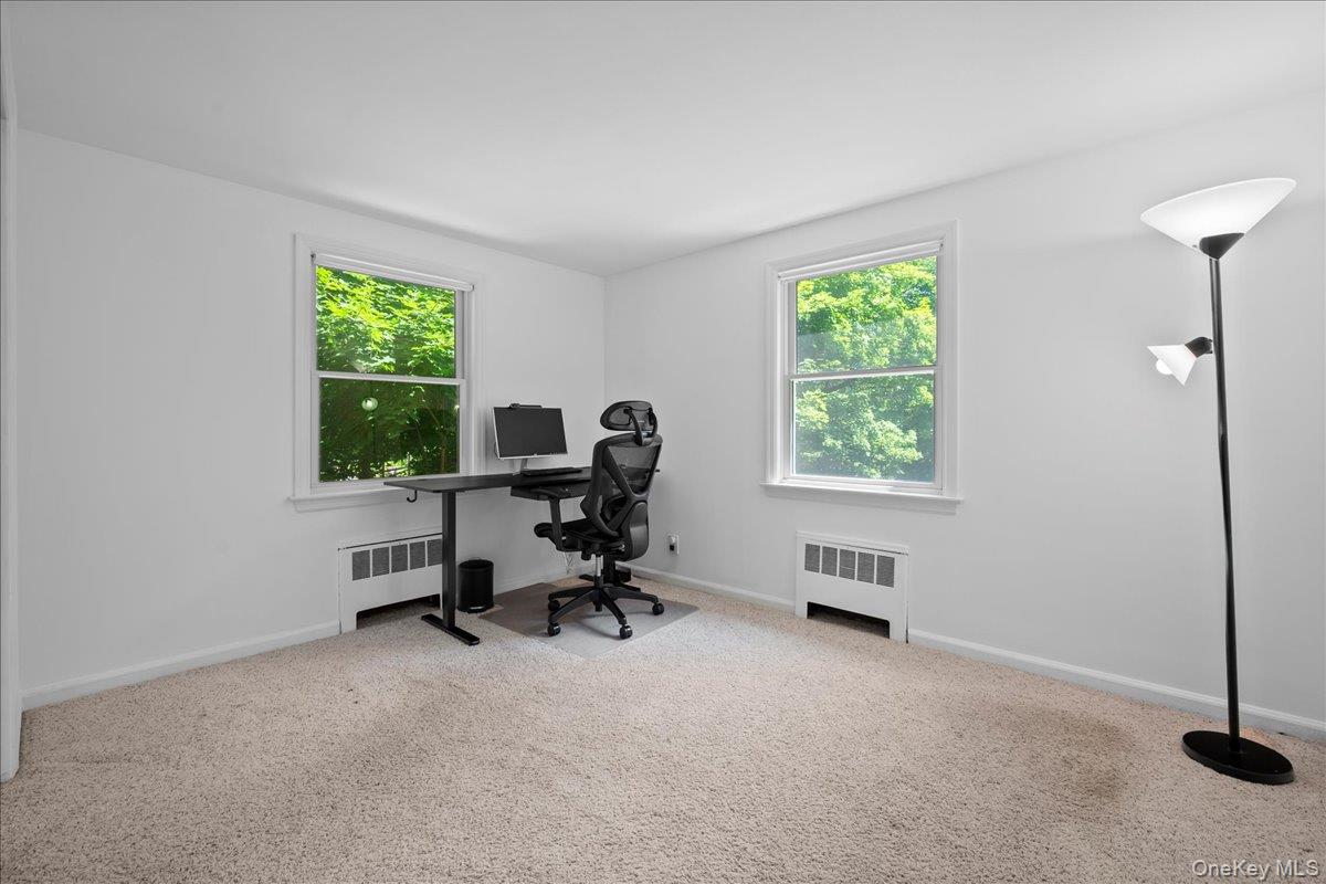 105 High St Extension Mount Kisco, NY 10549 - Photo 25 of 38 a view of a workspace with furniture and a window