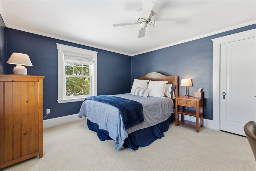 53 Prairie Street Concord, MA 01742 - Photo 14 of 26 a spacious bedroom with a bed and a window