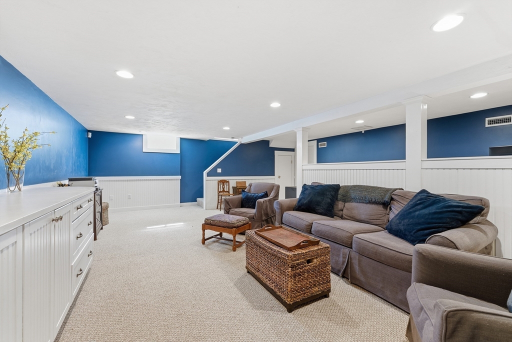 53 Prairie Street Concord, MA 01742 - Photo 16 of 26 a living room with furniture and a view of kitchen