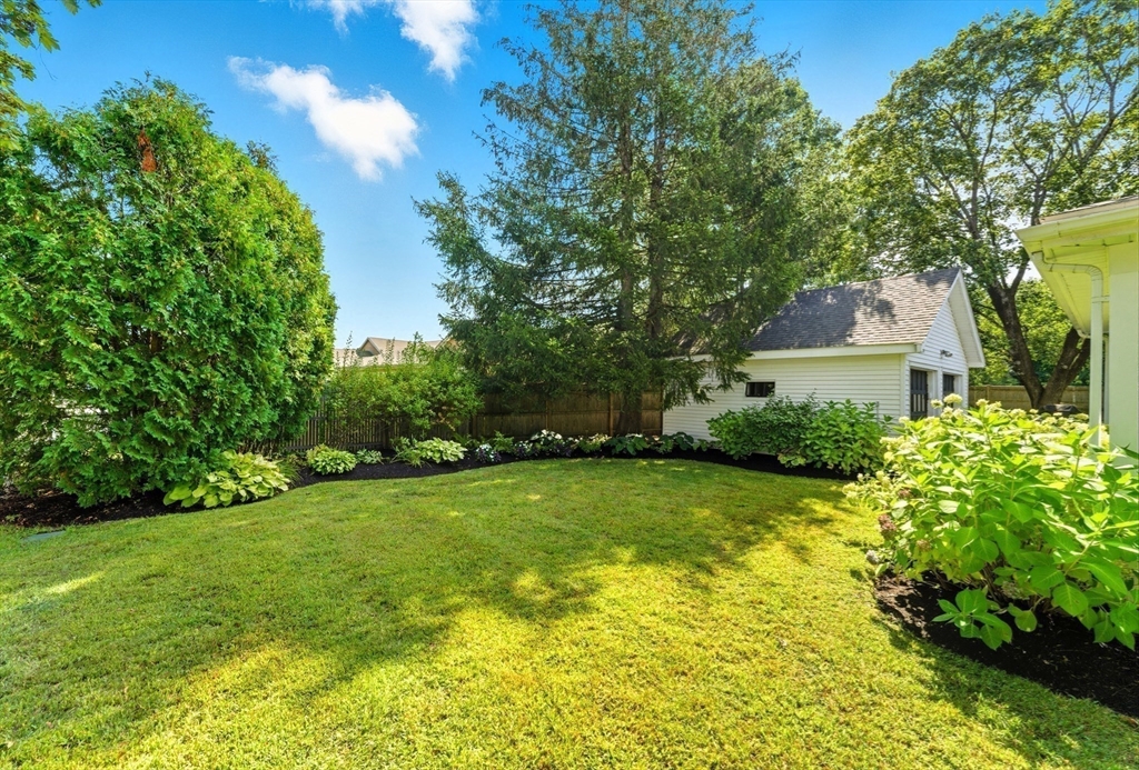 53 Prairie Street Concord, MA 01742 - Photo 19 of 26 a house view with a garden space