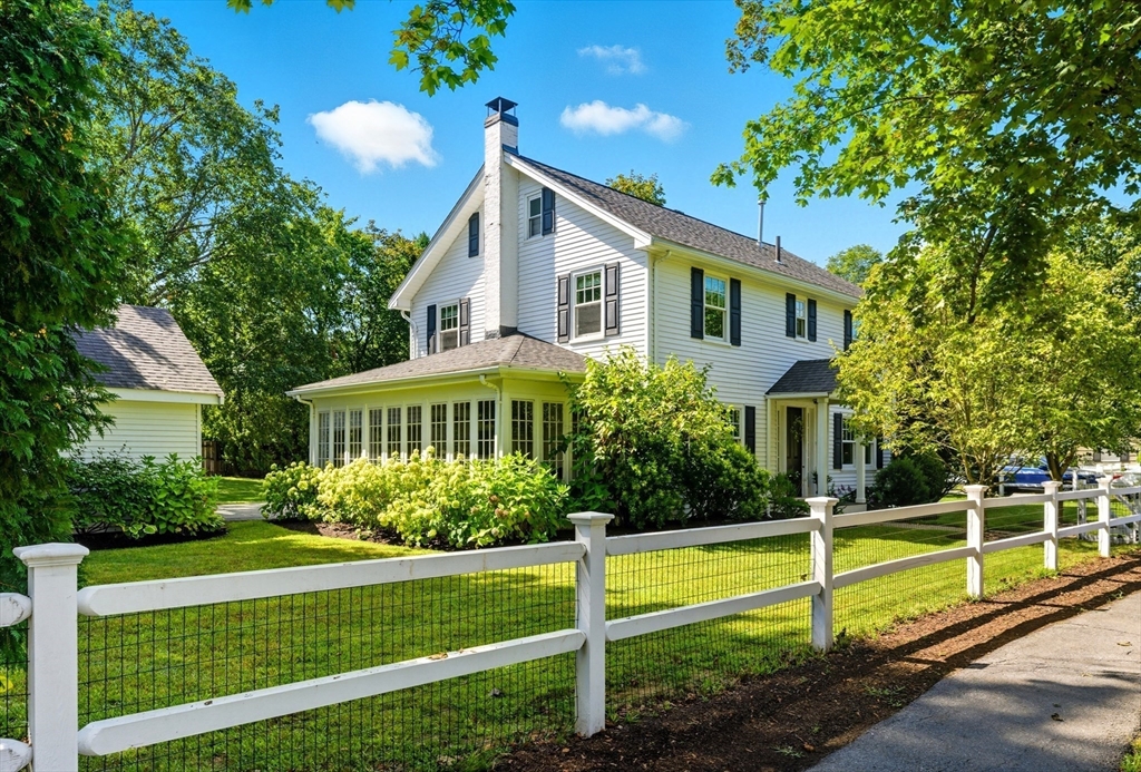 53 Prairie Street Concord, MA 01742 - Photo 2 of 26 a view of a house with a yard and plants