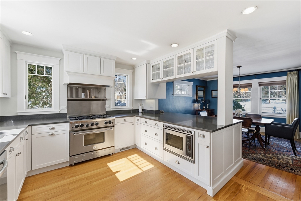 53 Prairie Street Concord, MA 01742 - Photo 4 of 26 a kitchen with stainless steel appliances granite countertop a stove and a sink