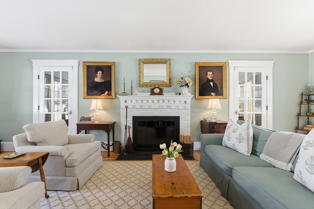 53 Prairie Street Concord, MA 01742 - Photo 8 of 26 a living room with furniture and a fireplace