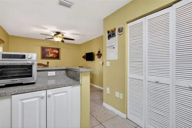 a kitchen with stainless steel appliances granite countertop a sink and a cabinets