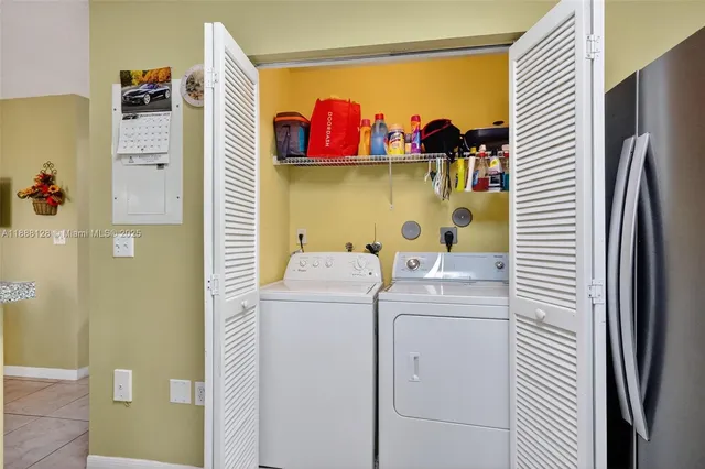 a utility room with dryer and washer