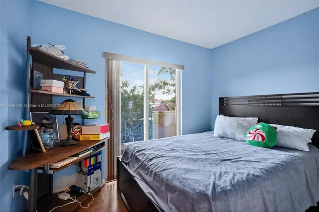 a bedroom with a bed and a book shelf