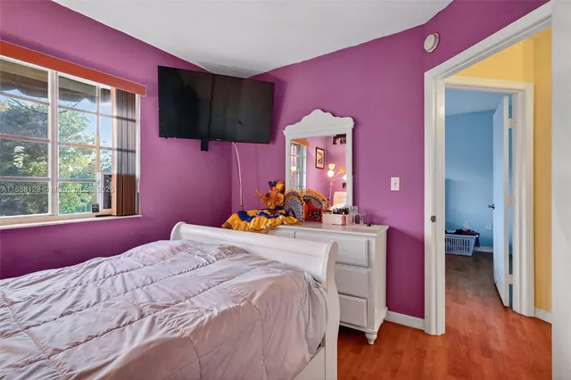 a bed room with a bed and a dresser