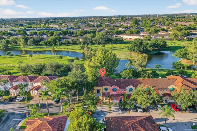 a view of a city with plants and lake view