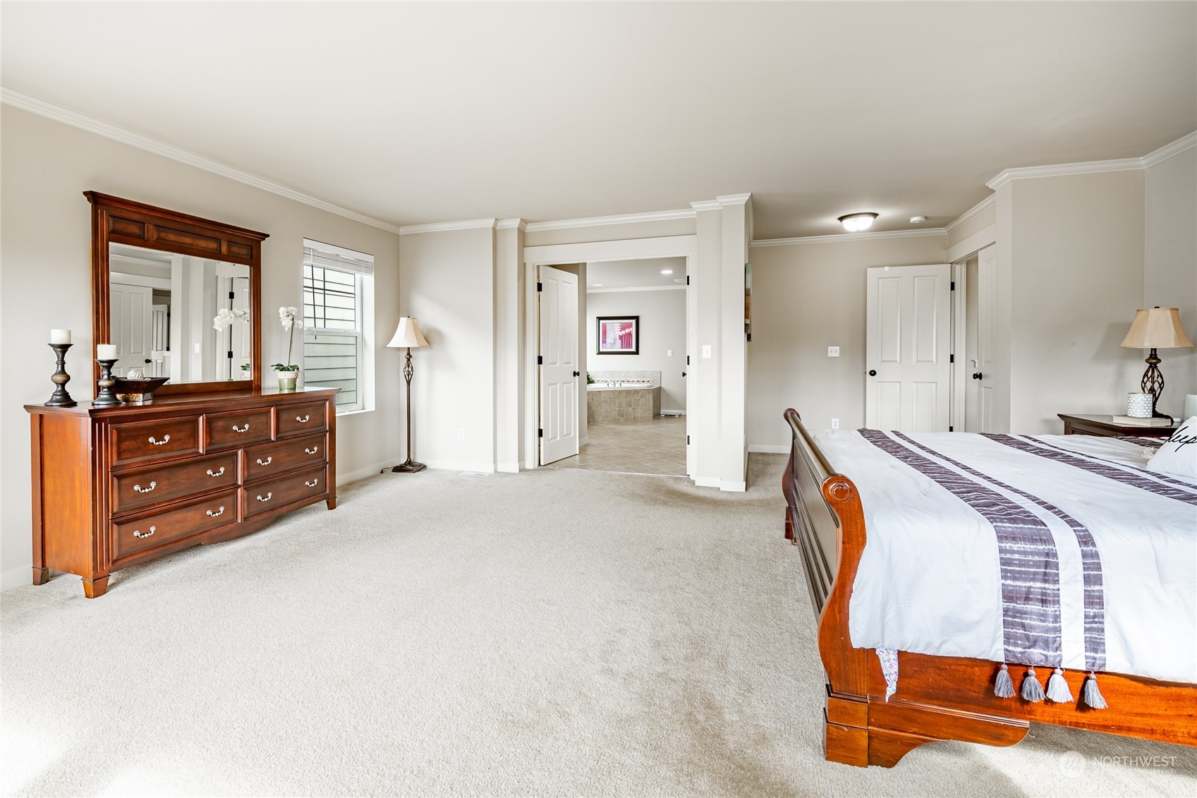 22831 36th Drive Southeast Bothell, WA 98021 - Photo 22 of 40 a spacious bedroom with a bed and a cabinets