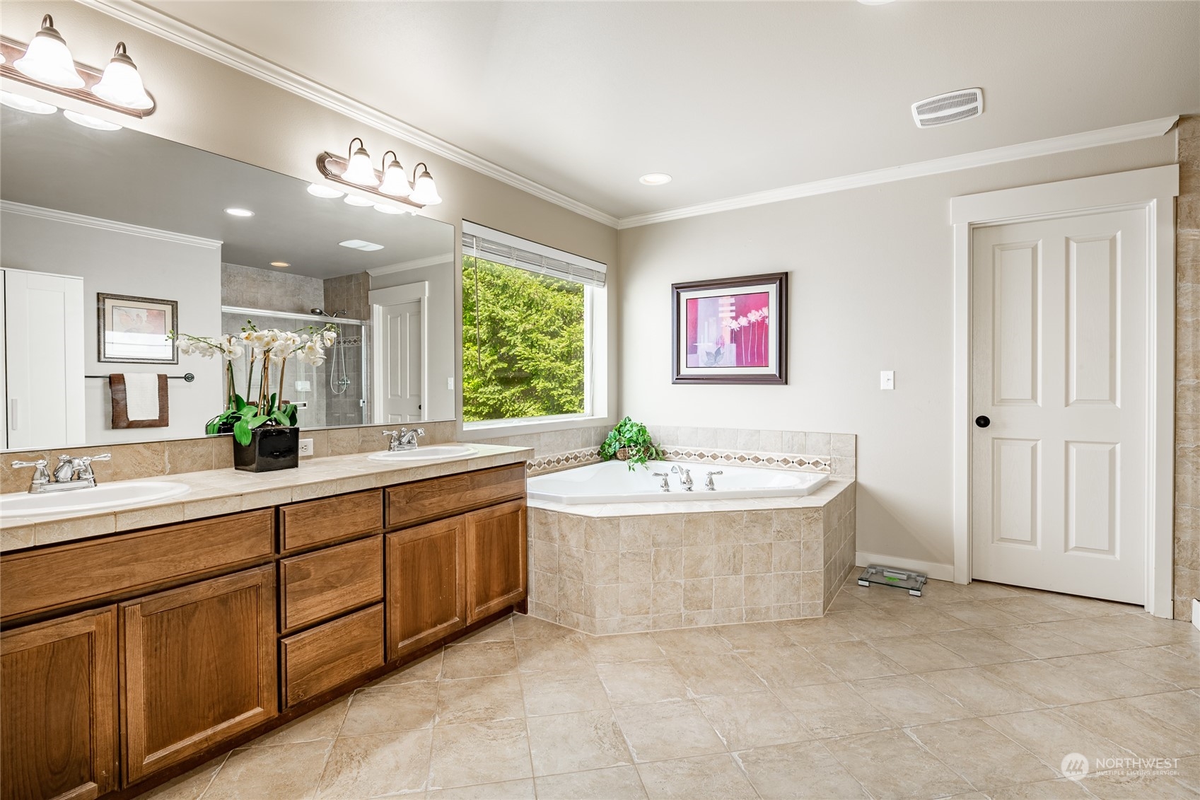 22831 36th Drive Southeast Bothell, WA 98021 - Photo 24 of 40 a spacious bathroom with a double vanity sink a mirror and a bathtub