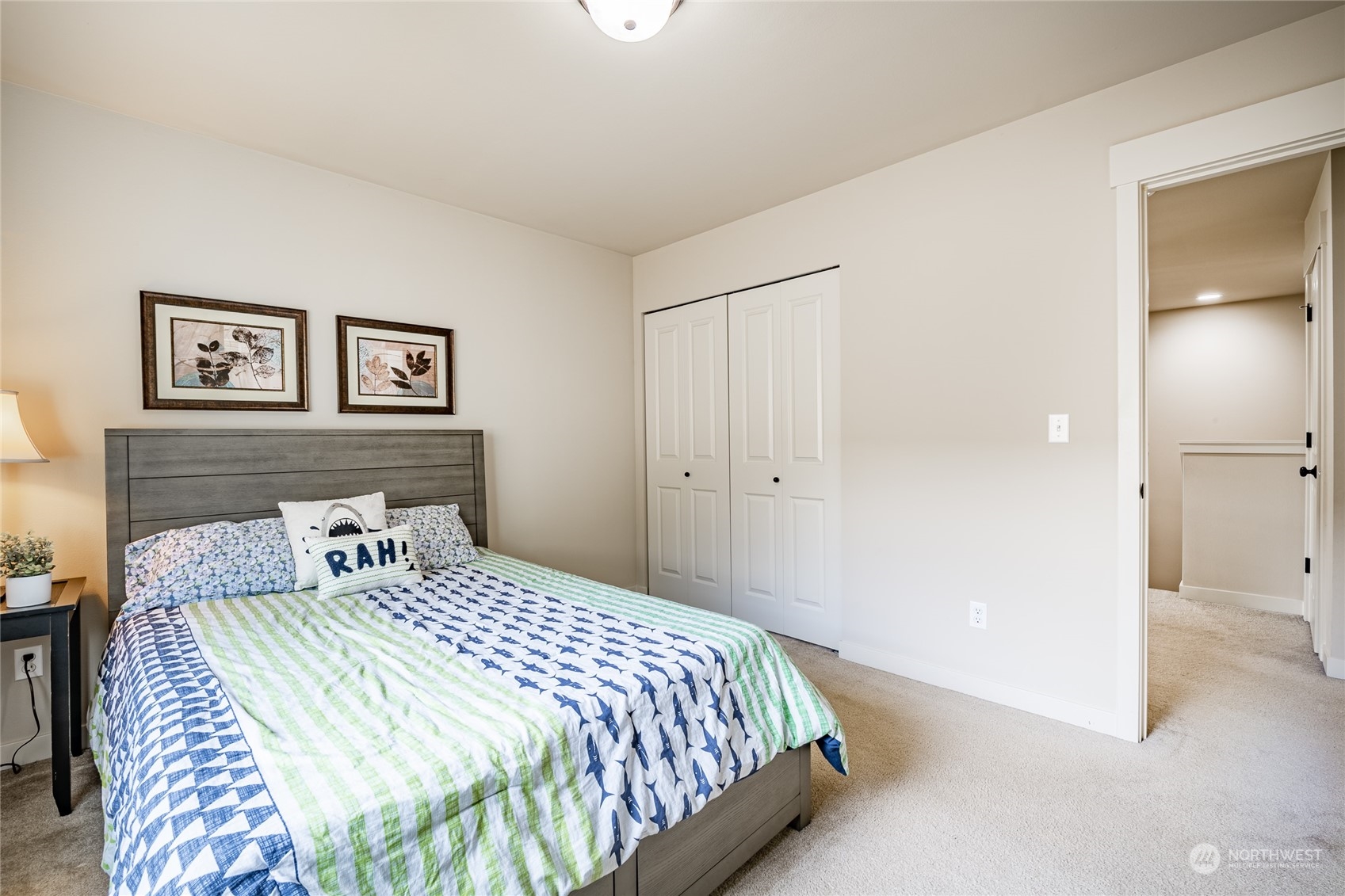 22831 36th Drive Southeast Bothell, WA 98021 - Photo 28 of 40 a bedroom with a large bed and a painting on the wall