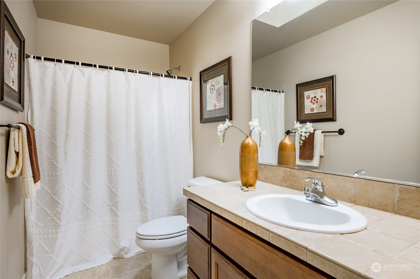 22831 36th Drive Southeast Bothell, WA 98021 - Photo 31 of 40 a bathroom with a granite countertop sink and a mirror