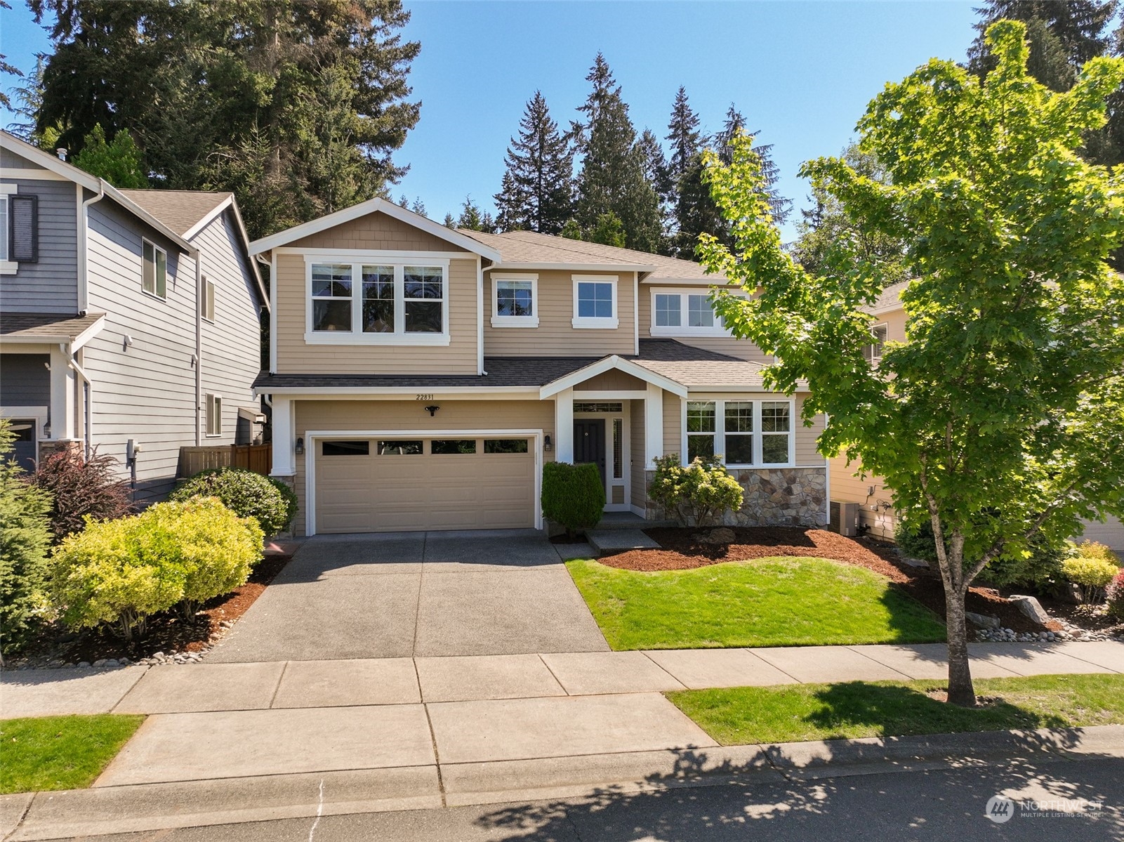22831 36th Drive Southeast Bothell, WA 98021 - Photo 38 of 40 a front view of a house with a garden
