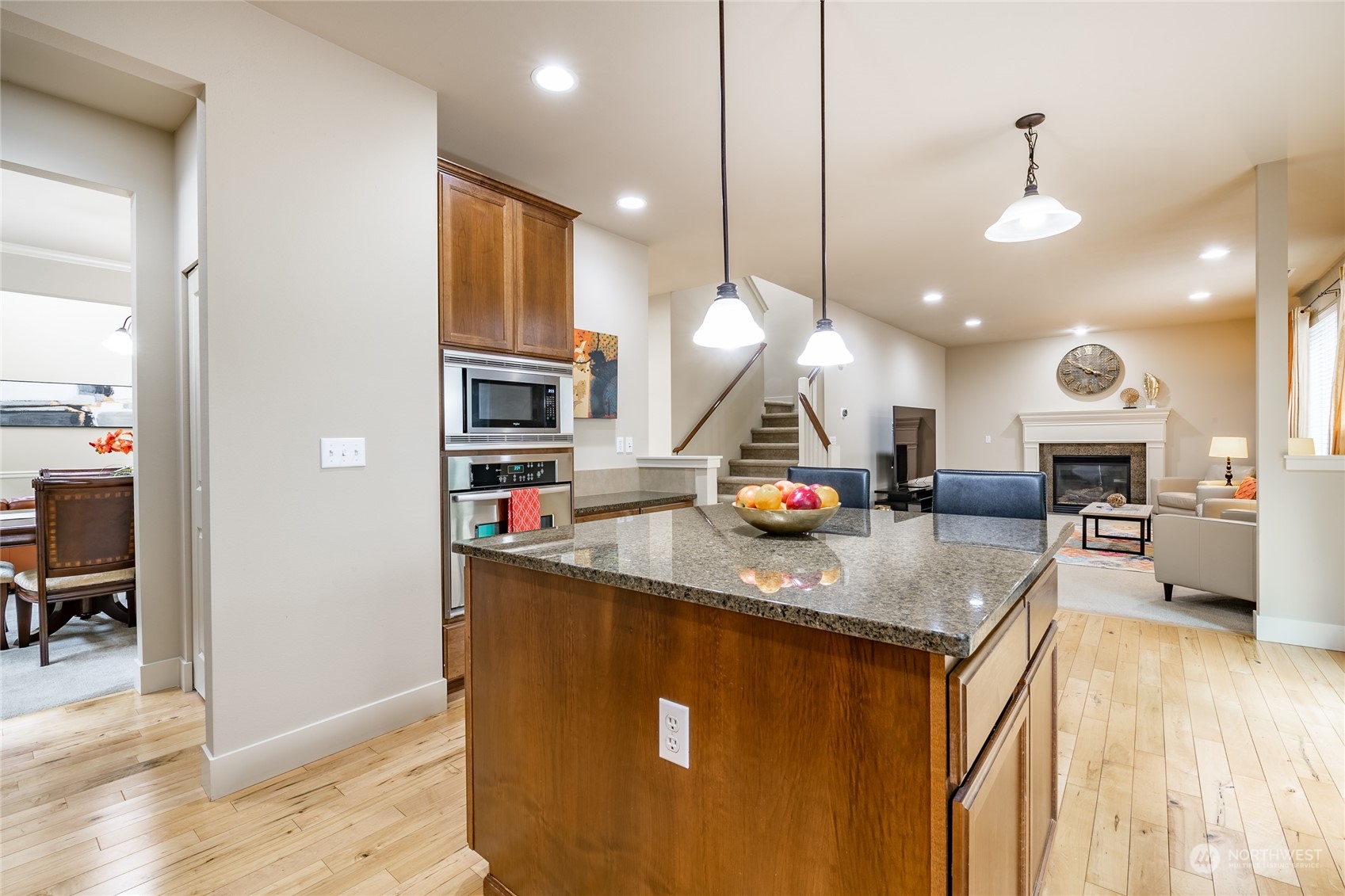 22831 36th Drive Southeast Bothell, WA 98021 - Photo 8 of 40 a kitchen with stainless steel appliances granite countertop a sink a stove and a wooden floors