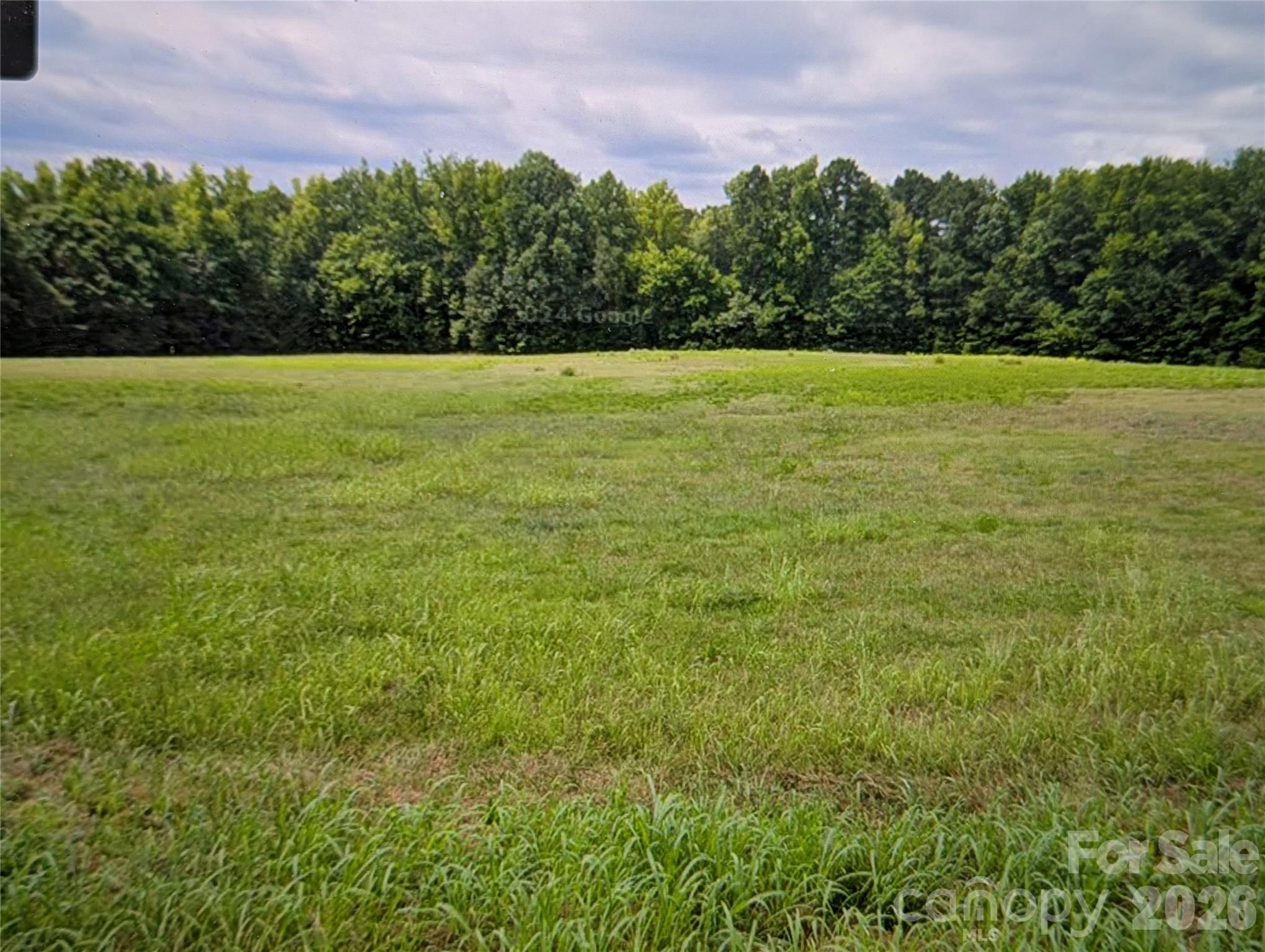 0 Oak Drive McConnells, SC 29726 - Photo 1 of 7 a view of a field with an trees in the background