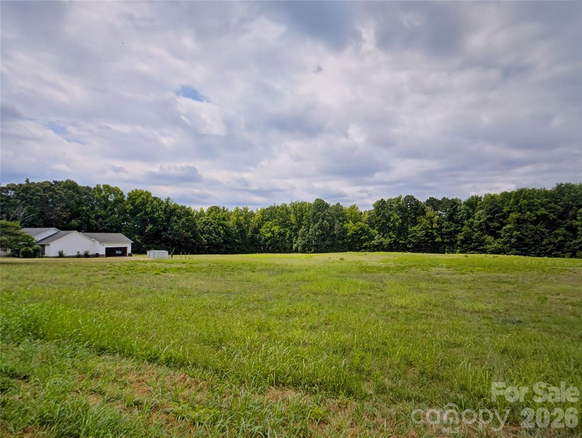 0 Oak Drive McConnells, SC 29726 - Photo 4 of 7 a view of a big yard with lots of green space and fog