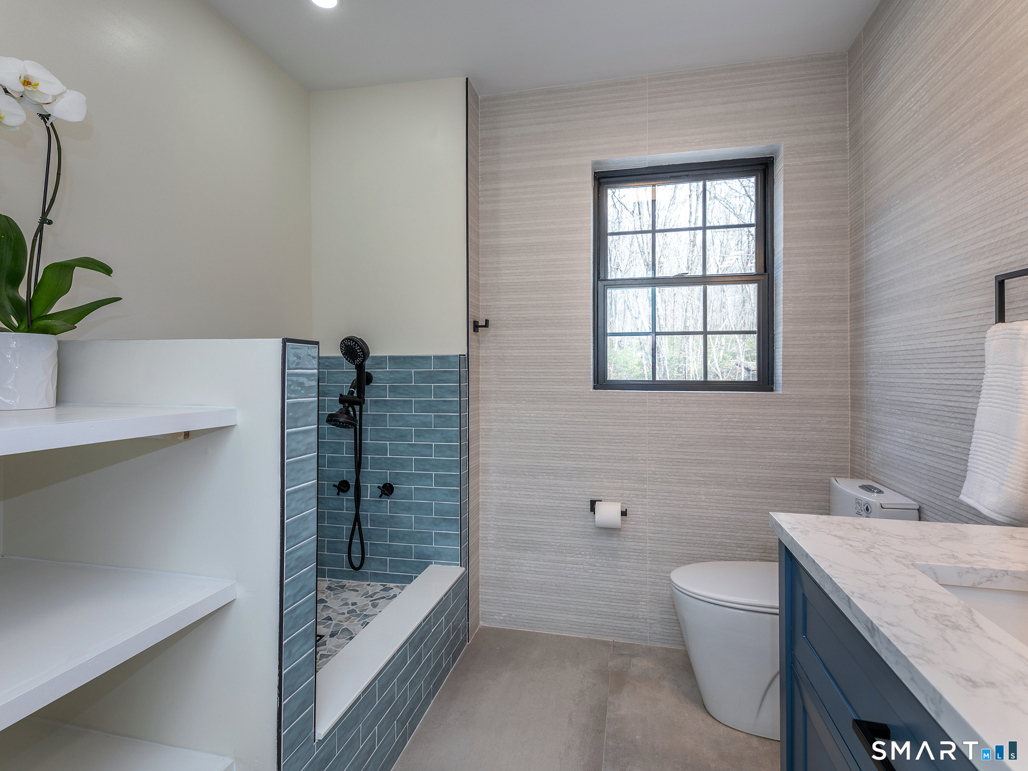 53 Mountain Lake Road Warren, CT 06777 - Photo 32 of 40 a bathroom with a granite countertop sink a toilet and shower