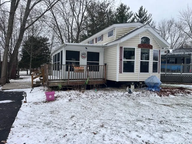 a front view of a house with wooden fence