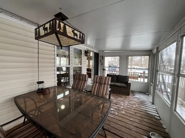 a view of a backyard with chairs and a stove