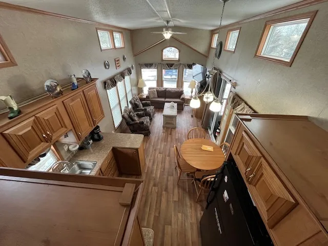 a view of a dining room with furniture and a chandelier
