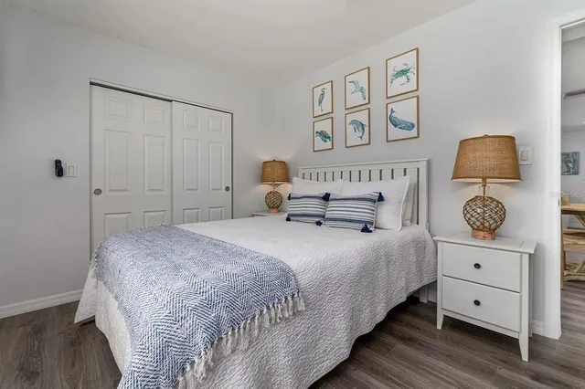 a bedroom with a bed and a dresser