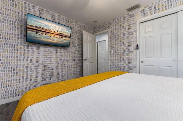 a white toilet sitting in a bathroom next to a window