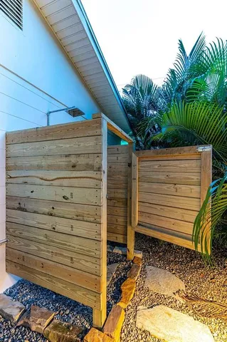 a view of a swimming pool with an outdoor seating and a yard