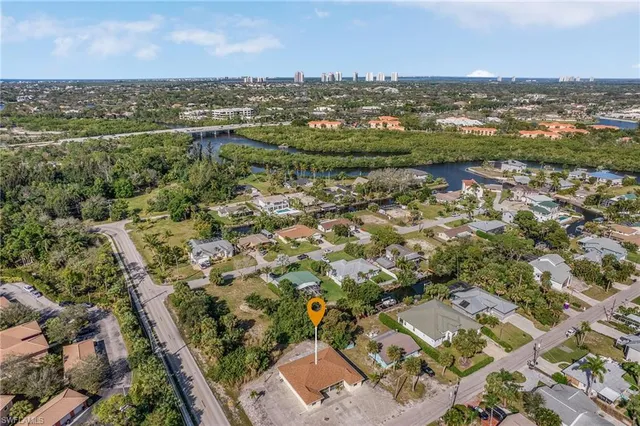 an aerial view of residential houses with city view