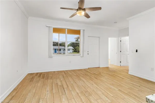 a view of a kitchen from the hallway