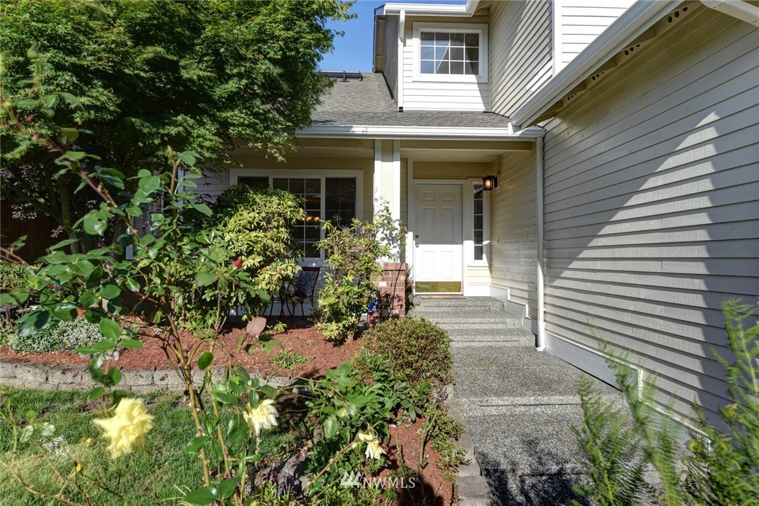 23215 9th Place West Bothell, WA 98021 - Photo 2 of 24 a front view of a house with a yard