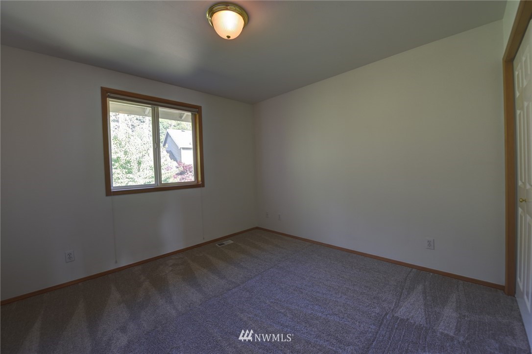 23215 9th Place West Bothell, WA 98021 - Photo 16 of 24 an empty room with windows