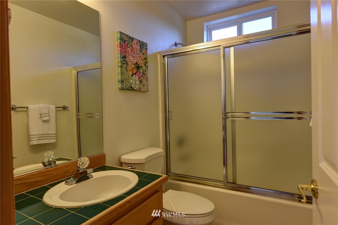 23215 9th Place West Bothell, WA 98021 - Photo 17 of 24 a bathroom with a sink toilet and shower