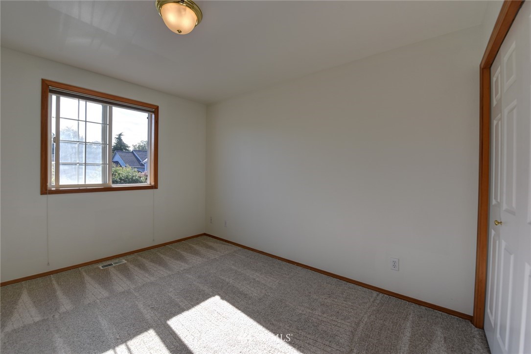 23215 9th Place West Bothell, WA 98021 - Photo 18 of 24 a view of empty room with wooden floor and fan