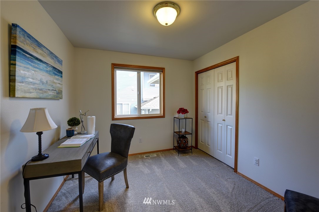 23215 9th Place West Bothell, WA 98021 - Photo 19 of 24 a room with furniture and a window